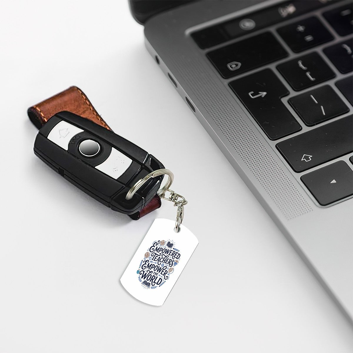 Empower Teachers Empower The Wolrd - Rectangular Metal Keychain - Estrella & The Stars
